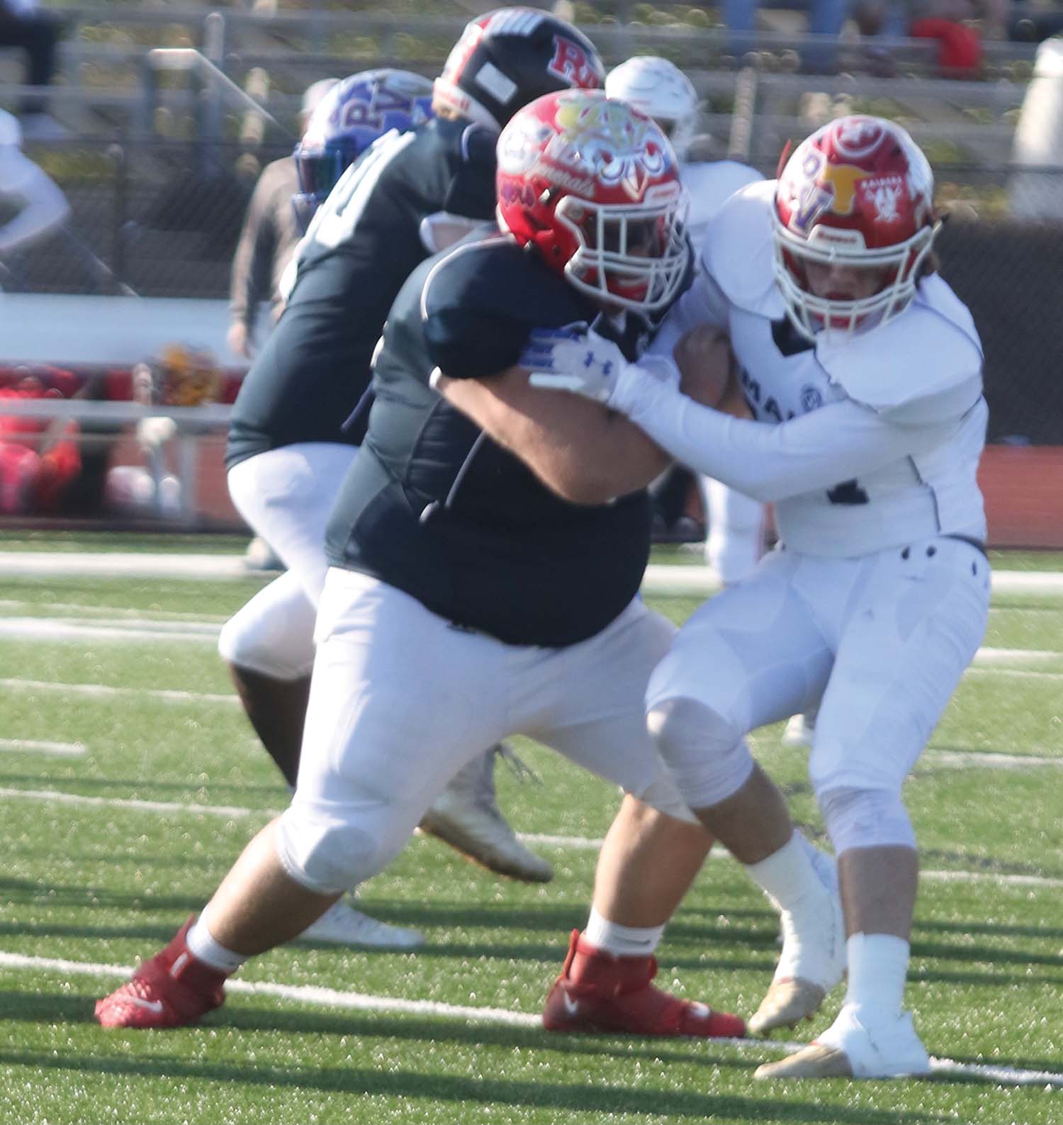 NCAs Trey Mathis blocks teammate Colby Hollingsworth in the MAIS all-star football game.