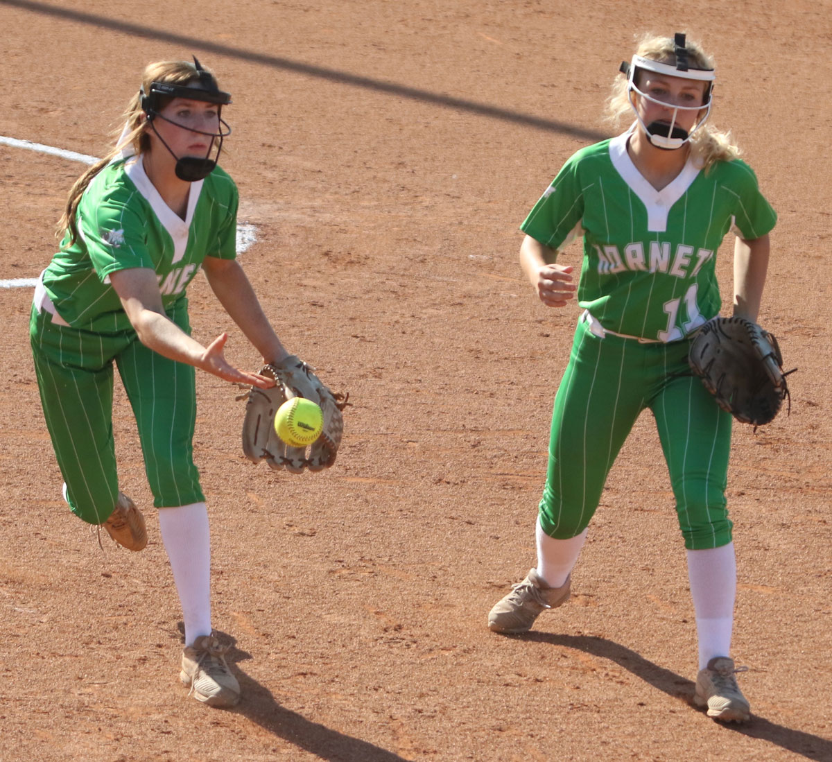 Lakes Laurel Breland flips a ball to first base for an out against Mantachie on Wednesday.