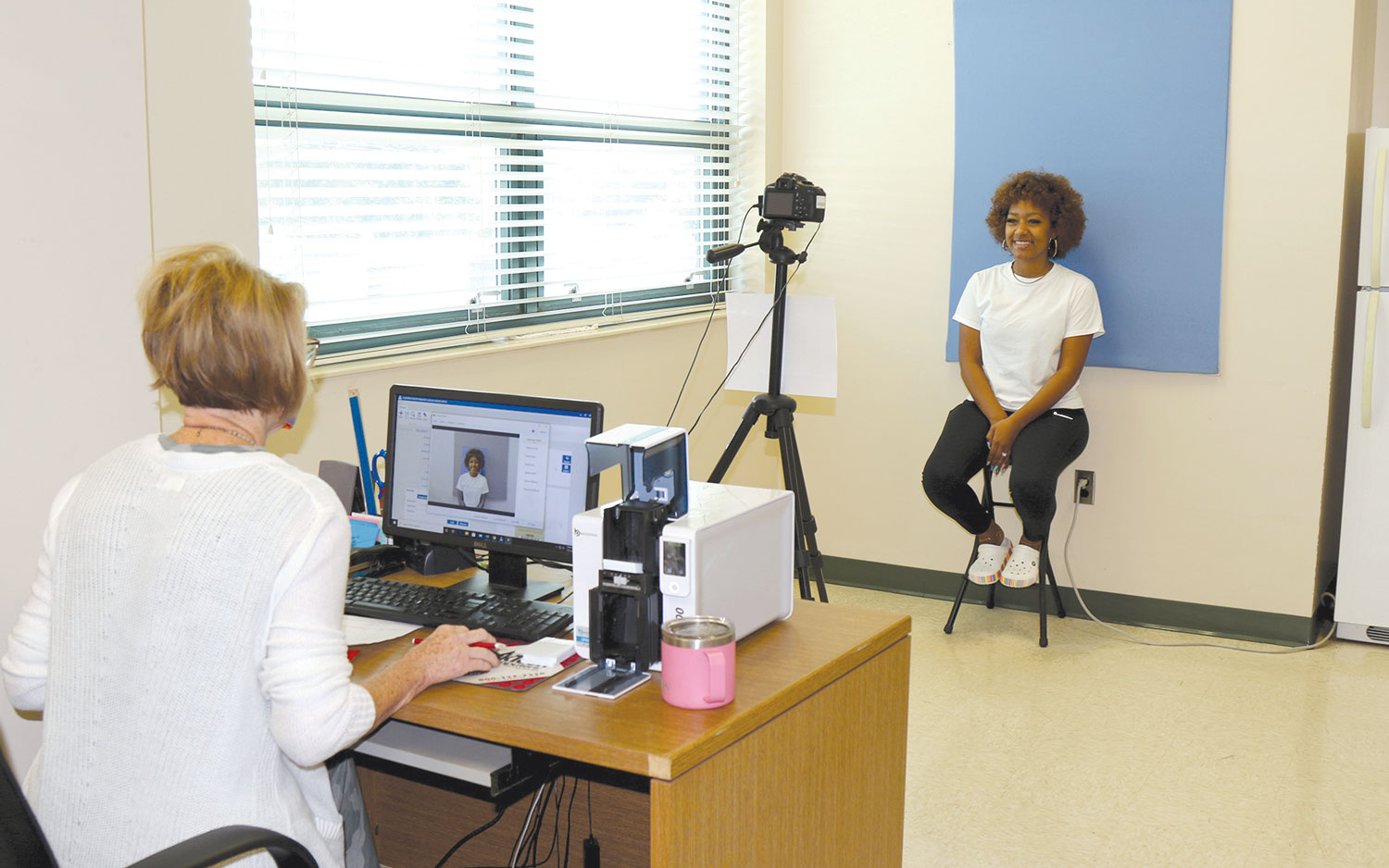 East Central Community College is holding Orientation sessions for new students in July on the campus in Decatur. New freshman and transfer students are coming to campus on designated dates to have their student IDs made, pick up parking decals, and receive Orientation packets, while wearing masks and practicing social distancing. Above: Newton graduate Beanna Aguilar sits for her Student ID photo while attending one of East Central Community College’s special Orientation sessions