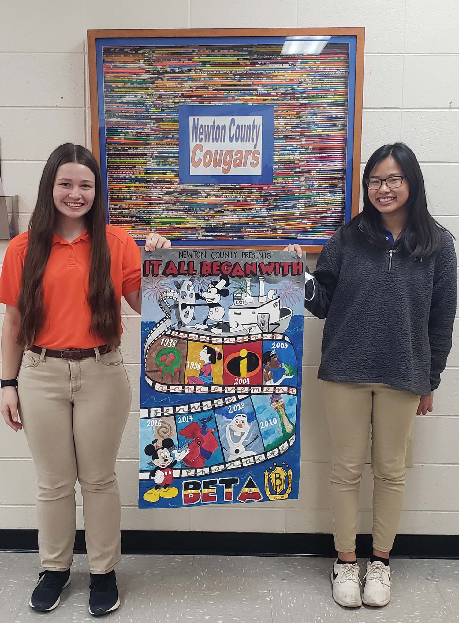 The Newton County High School Beta Club qualified to compete at the National Beta Competition in Orlando, Florida during the State Beta Convention recently. Ellie Winter (left) earned second place in Creative Writing and Alexis Tran won Grand Champion in the 2-D Banner Competition. Ellie and Alexis are pictured with the Grand Champion Banner.  Submitted photo