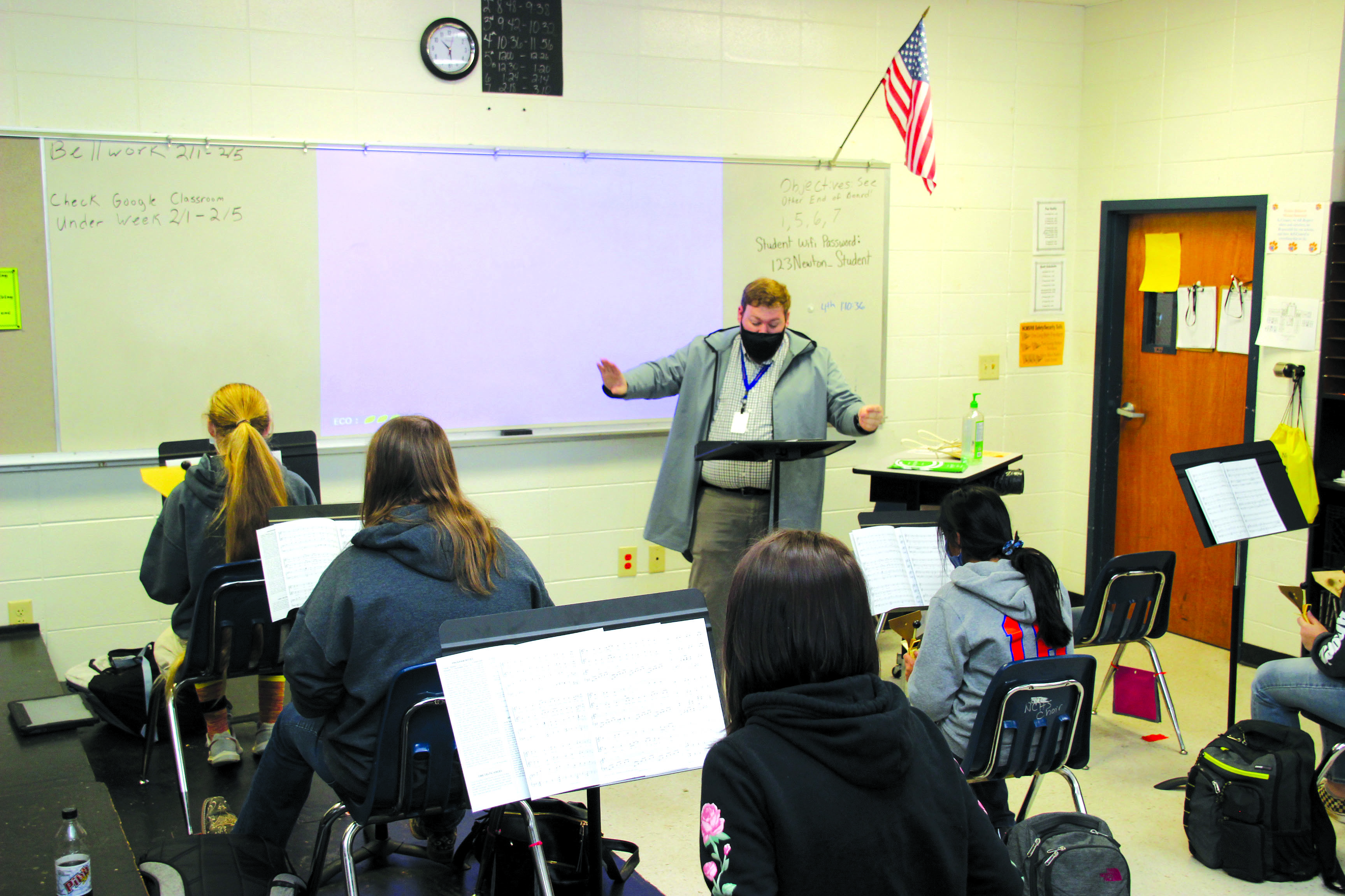 Newton County High School Choral Director Chandler Smith directs as chorus students play “Molly Malone” on the hand bells. According to Smith, “one of the benefits of the hand bells is the students are still working on skills that can carry over into future choral singing.” Submitted photo
