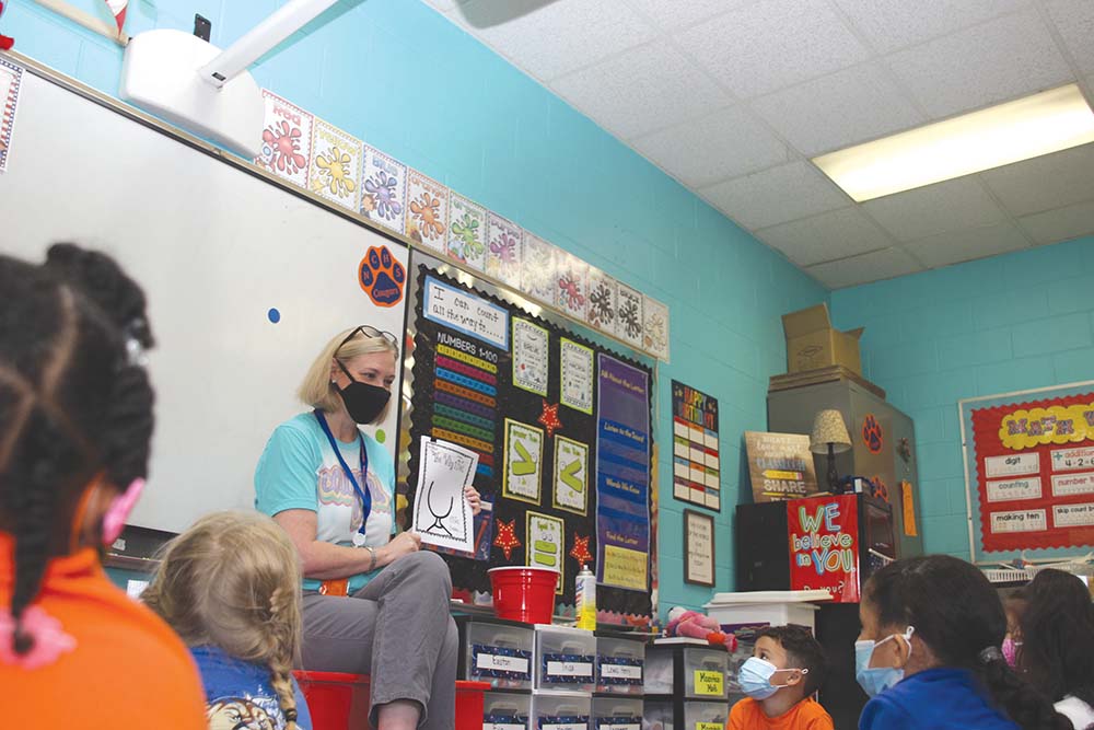 Newton County Elementary School Counselor Christi Gregory speaks to kindergarten students on “feelings” and challenges each student to reflect their feelings on a “the way I feel” handout. 