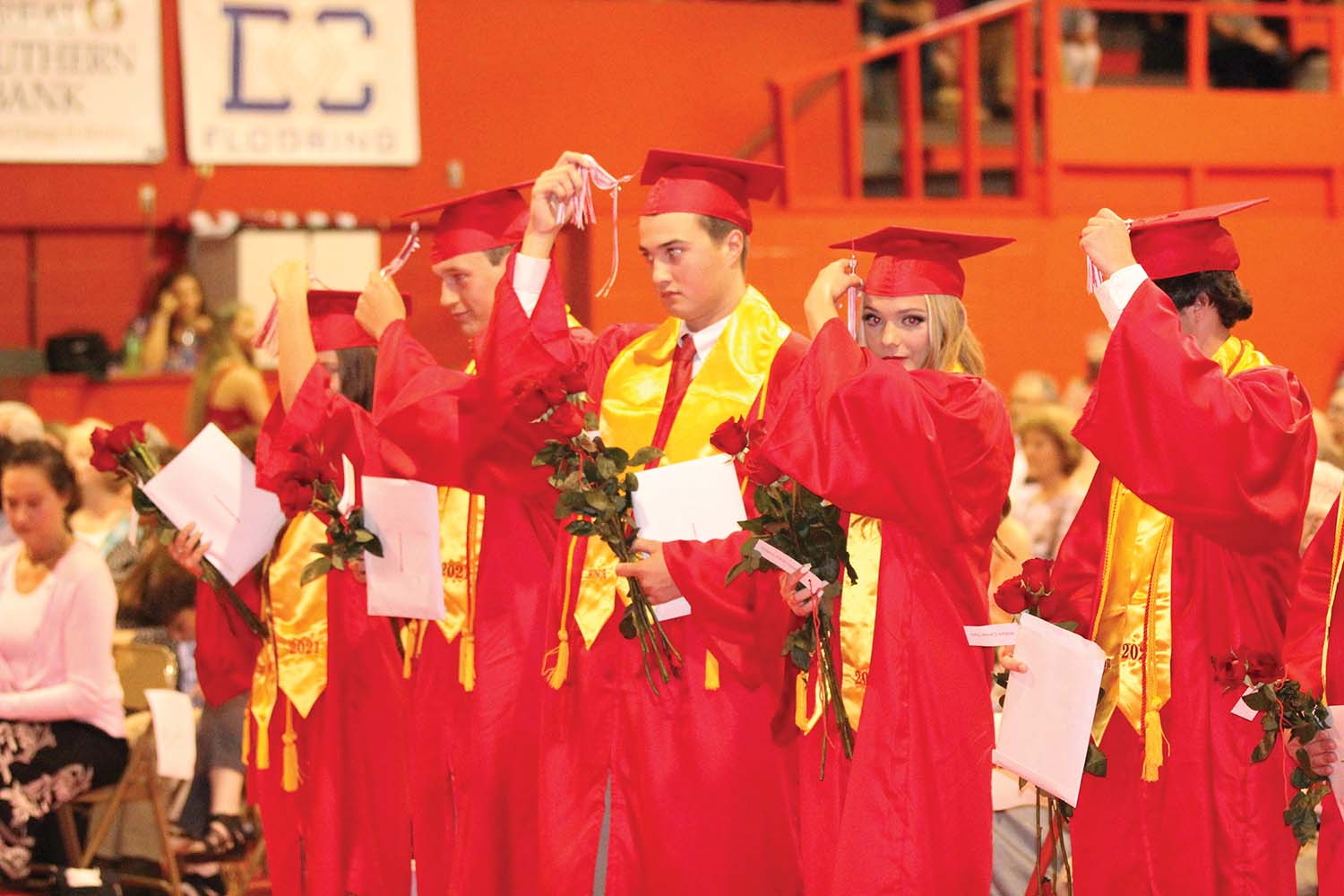 Gracie Humphreys, Lee Hollingsworth, Caleb Cosgrove, Bella Collins and Conner Clark turn tassels.