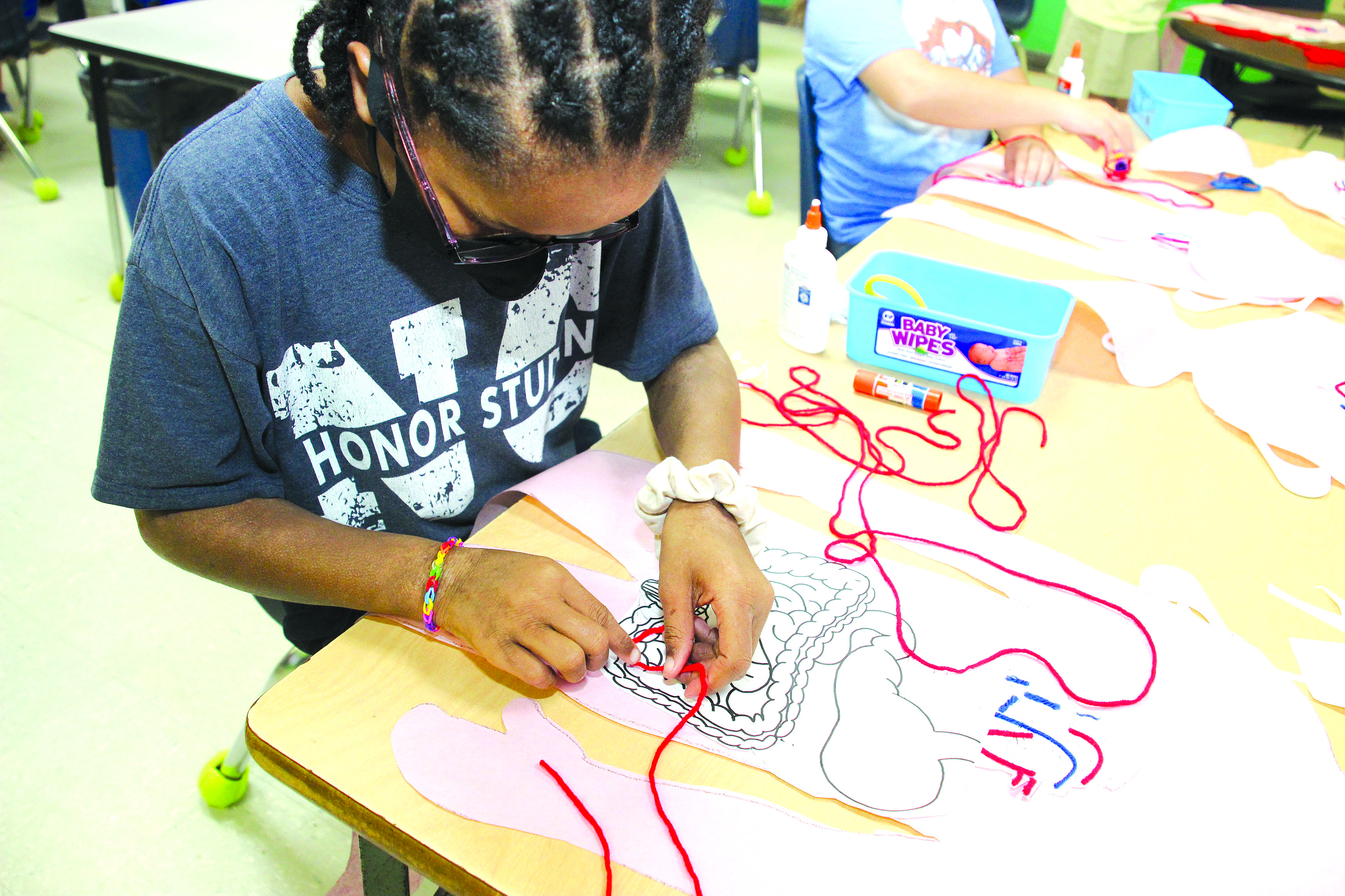 ​Did you know the average length of the entire digestive system is 30 feet? Newton County Elementary fourth grader Lianna Williams in Sherri Walker’s classroom follows directions as she navigates through the digestive system during science lab rotation this week. Paula Berryhill is the NCES science lab instructor. [Click and drag to move] ​