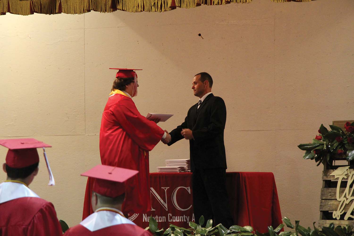 Parker Castle receives diploma from NCA board president Adam Godwin
