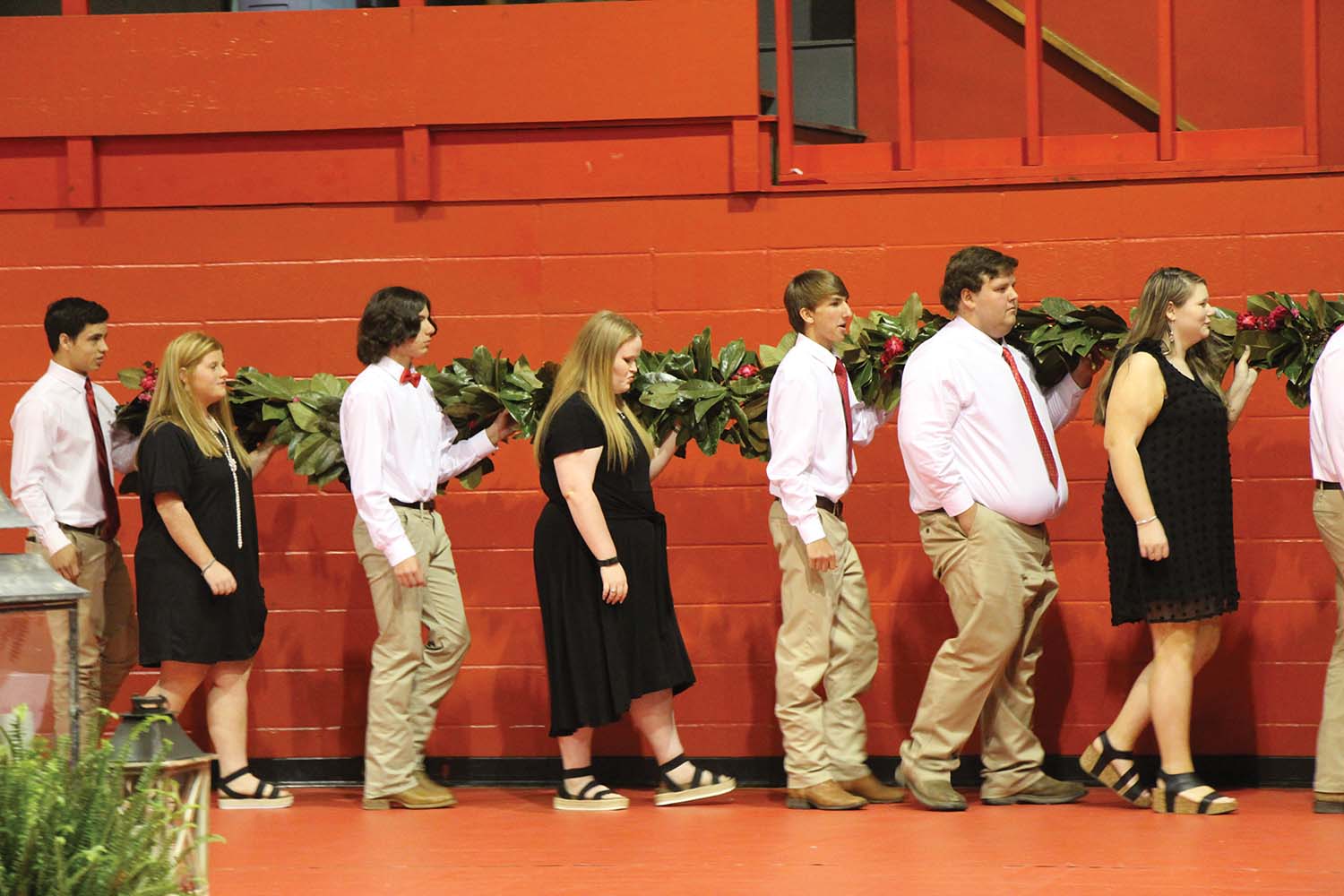 NCA Juniors present rose chain