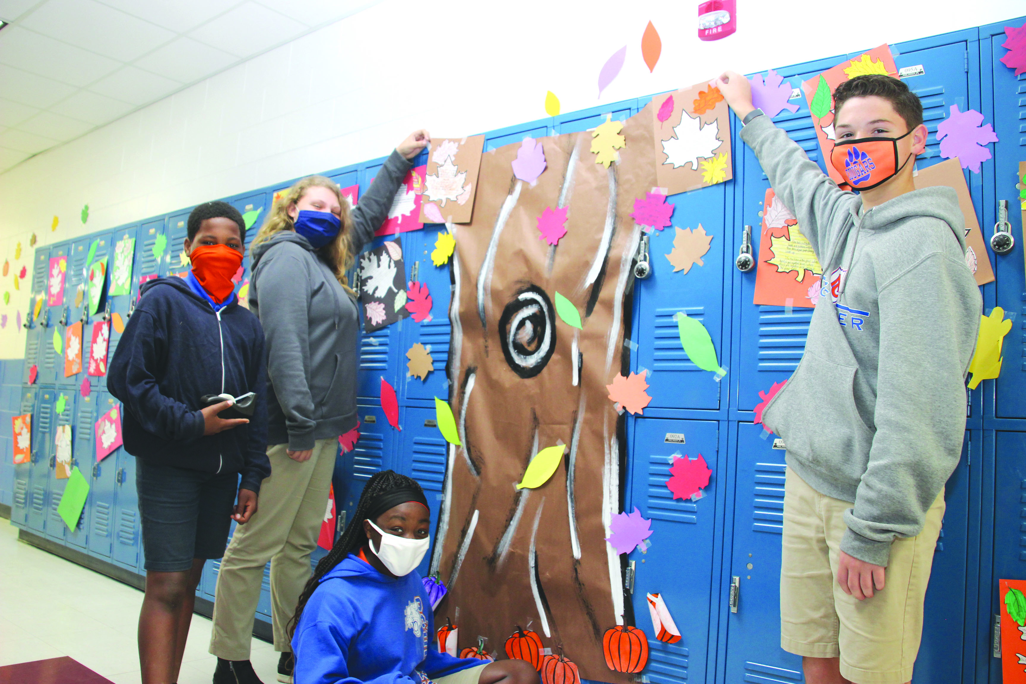 During these nine weeks at Newton County Middle School, eighth grade students in Joy Munn and Lora Fulton’s Science and English Language Arts classes studied and wrote about the transition to fall. While eighth grade students were studying poetry and writing poems on fall leaves in Lora Fulton’s English classes, they were also identifying traits about themselves and color coding the trait with a fall leaf in Joy Munn’s Science classes. The completed project gave students the opportunity to create a fall display on the 200 Hall from left: Roaman Bender, Jaymie Henry, DeLiya Flowers and Seth Gipson.