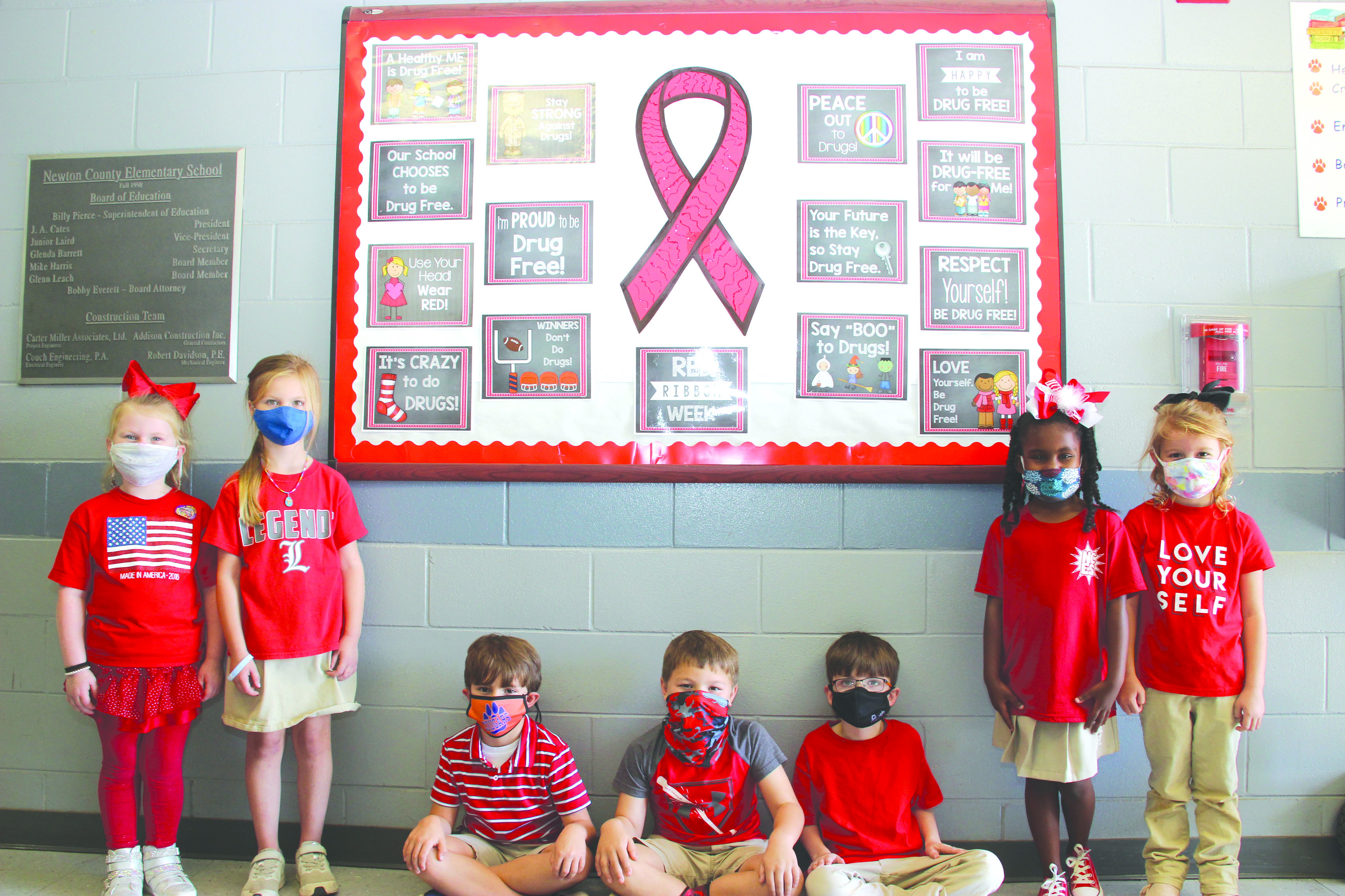 First grade representatives of the Newton County Elementary School Extreme Team wear red during Red Ribbon Week proclaiming “We are PAWS-itively Drug Free!” From left, Ansley May, Georgia McGee, Eli Huddleston, Cole Caldwell, Mason Smith, Nylee Autman and Charlie Pearson. The NCES Extreme Team initiative promotes safety on campus and class representatives provide extra eyes for lost items and assist in finding the owners.