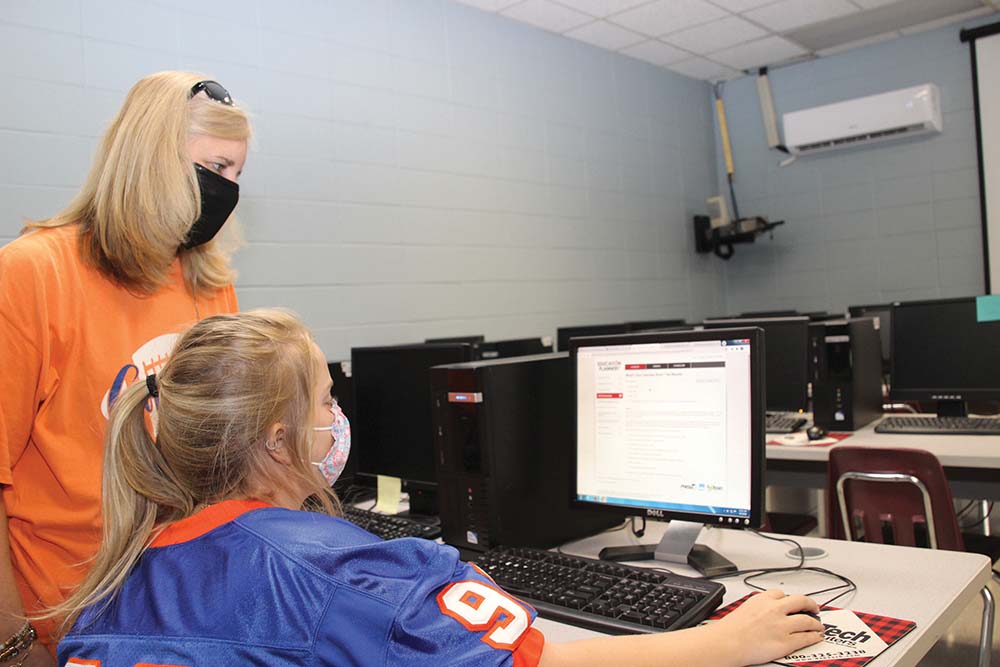 Newton County Career and Technical Center’s Student Services Coordinator Tracy Holliman assists Newton County High School Senior Faith Dejarnett as she completes her learning styles and career interests inventory. All students are given the inventory as part of the vocational standards.
