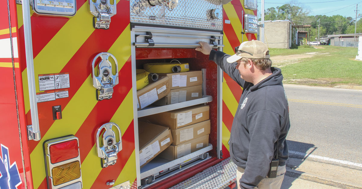 Robert Holder looks in the new city fire truck. The city will draw down its general fund to pay for the truck while it waits on its financing. Once it is approved, the city will refund the general fund the full amount of the truck. Brent Maze/The Appeal