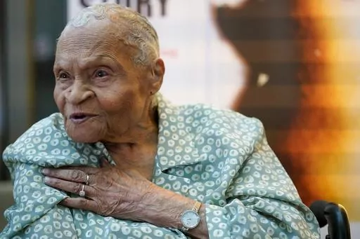 Tulsa Race Massacre survivor Viola Ford Fletcher gestures while speaking during an interview with The Associated Press, Friday, June 16, 2023, in New York. At age 109, Fletcher is releasing a memoir about the life she lived in the shadow of the massacre after a white mob laid waste to the once-thriving Black enclave known as Greenwood. “Don't Let Them Bury My Story” is published Tuesday, July 4, and becomes widely available for purchase on Aug. 15. (AP Photo/Mary Altaffer)
