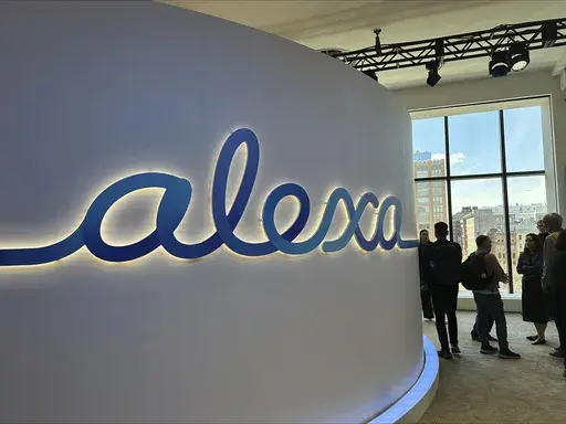 People attend an event where Amazon on Wednesday, Feb. 26, 2025, unveiled a generative-AI infused Alexa that it says will allow the popular voice assistant to have more personality, check a user’s tone and even plan romantic dates. (AP Photo/Wyatte Grantham-Philips)