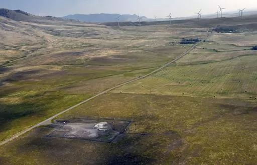 In this image provided by the U.S. Air Force, wind turbines spin near the Malmstrom Air Force Base missile launch site Alpha-03 in Geyser, Mont., in August 2023. As the nation's energy needs have increased, turbines have grown in size and number, and are being placed closer to the underground silos where Minuteman III intercontinental ballistic missiles are kept ready to fire. The Air Force is concerned that the turbines are making it dangerous for their helicopter crews to fly out to the sites,