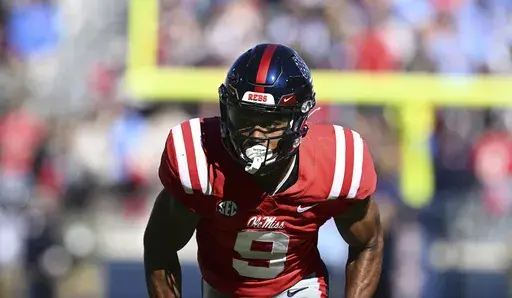 Mississippi wide receiver Tre Harris (9) runs a route during the first half of an NCAA college football game against Louisiana Monroe in Oxford, Miss., Nov. 18, 2023. (AP Photo/Thomas Graning, file)