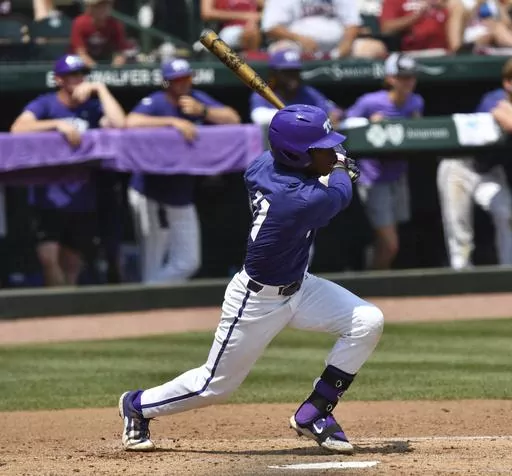 TCU's Austin Davis connects with two-run single against Arkansas during the second inning of an NCAA college baseball tournament regional championship game in Fayetteville, Ark. Monday, June 5, 2023. (Andy Shupe/The Northwest Arkansas Democrat-Gazette via AP)