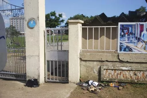 A view of sandles outside Kings Assembly Pentecostal church, following a stampede in Port Harcourt, Nigeria, Saturday, May 28, 2022. Police say a stampede at a church charity event in southern Nigeria has left at least 31 people dead and seven injured. One witness said the dead included a pregnant woman and “many children.” Police said the stampede took place at an annual “Shop for Free” program organized by the Kings Assembly Pentecostal church in Rivers state. Such events are common in