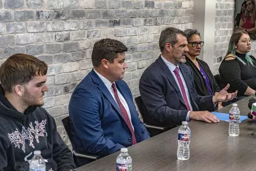 Attorney Tommy Hastings, third from left, speaks on behalf of his and fellow attorney Gabe Sassin's clients during a press conference, Wednesday, April 24, 2024 in The Woodland, Texas. Several relatives of patients who died while waiting for a new liver said Wednesday they want to know if their loved ones were wrongfully denied a transplant by Dr. Steve Bynon, a Houston doctor accused of manipulating the waitlist to make some patients ineligible to receive a new organ. (Kirk Sides/Houston Chroni