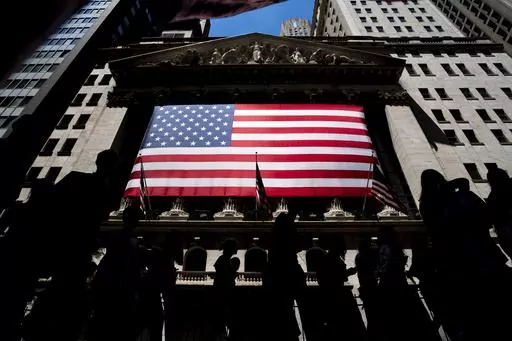 People walk past the New York Stock Exchange on Wednesday, June 29, 2022 in New York. Wall Street pointed higher before the open Friday, Nov. 17, 2023, as most major markets looked set to end the week with solid gains. (AP Photo/Julia Nikhinson)