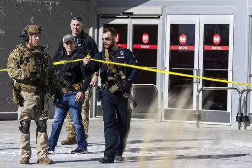 Law enforcement officers are pictured at the scene of a reported shooting at a Target store in Omaha, Neb., on Tuesday, Jan. 31, 2023. Omaha Police Chief Todd R. Schmaderer says city police confronted and shot a man with an assault rifle. (Chris Machian/Omaha World-Herald via AP)