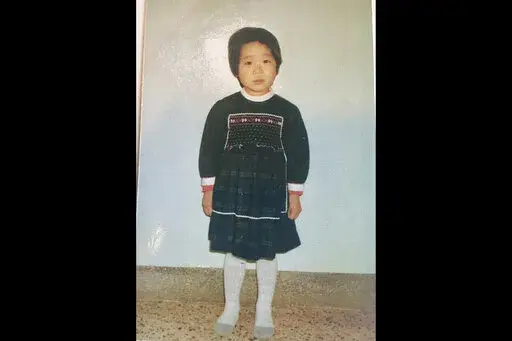 This undated photo provided by Joo-Rei Mathieson shows herself when she was in childhood taken in South Korea. A Brothers Home intake document describes Mathieson as a lost street kid brought in by police. It notes, chillingly for a government-sponsored vagrants' facility that survivors have told The Associated Press often worked children to death, that she's "capable of labor." She spoke no words for days, the document says, after entering Brothers, a now-destroyed facility in the southern port