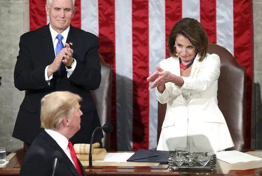 President Donald Trump turns to House Speaker Nancy Pelosi of Calif., as he delivers his State of the Union address to a joint session of Congress on Capitol Hill in Washington, as Vice President Mike Pence watches, Tuesday, Feb. 5, 2019. (AP Photo/Andrew Harnik, File)