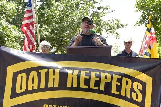 Stewart Rhodes, founder of the Oath Keepers, center, speaks during a rally outside the White House in Washington, June 25, 2017.  Federal prosecutors are preparing to lay out their case against the founder of the Oath Keepers’ extremist group and four associates. They are charged in the most serious case to reach trial yet in the Jan. 6, 2021, U.S. Capitol attack. Opening statements are expected Monday in Washington’s federal court in the trial of Stewart Rhodes and others charged with sedit