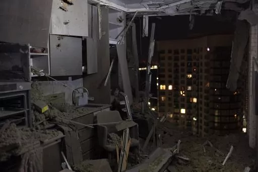 A damaged apartment is seen in Kyiv, Ukraine, Thursday, July 13, 2023, following Russia's air attacks targeting the capital city. (AP Photo/Jae C. Hong)