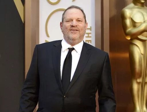 Movie mogul Harvey Weinstein arrives at the Oscars at the Dolby Theatre in Los Angeles, March 2, 2014. On Monday, Dec. 19, 2022, Weinstein was found guilty of rape at a Los Angeles trial in another #MeToo moment of reckoning, five years after he became a magnet for the movement. (Photo by Jordan Strauss/Invision/AP, File)