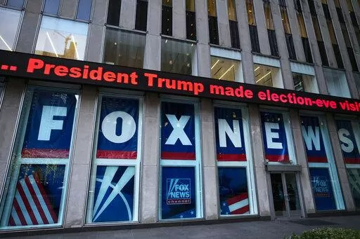 A headline about President Donald Trump is displayed outside Fox News studios, on Nov. 28, 2018, in New York. On Thursday, Feb. 16, the voting machine company Dominion filed court papers documenting that numerous Fox News personalities knew there was no evidence to support the claims peddled by Trump's allies, but aired them anyway on the nation's most-watched cable network. (AP Photo/Mark Lennihan, File)