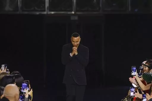 Designer Olivier Rousteing accepts applause after the conclusion of the Balmain Fall/Winter 2023-2024 ready-to-wear collection presented Wednesday, March 1, 2023 in Paris. Balmain artistic director Olivier Rousteing says robbers have made off with more than 50 pieces of the new collection that his Paris house intends to show at Fashion Week later this month. (Vianney Le Caer/Invision/AP, file)