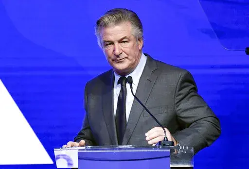 Alec Baldwin performs emcee duties at the Robert F. Kennedy Human Rights Ripple of Hope Award Gala at New York Hilton Midtown on Dec. 9, 2021, in New York.  Baldwin has surrendered his cellphone as part of the investigation into a fatal shooting on a New Mexico film set last fall. A Santa Fe County Sheriff’s Office spokesman says Baldwin’s phone was turned over Friday, Jan. 14, 2022, to authorities in New York's Suffolk County and that information from the phone will be provided to investiga