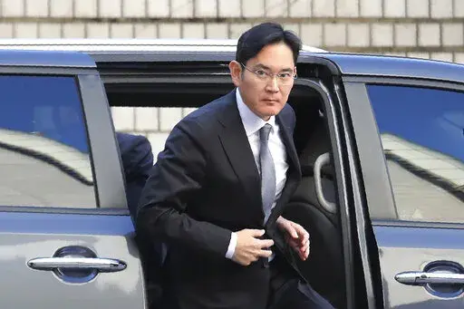 Samsung Electronics Co. Vice Chairman Lee Jae-yong gets out of a car at the Seoul High Court in Seoul, South Korea, Nov. 22, 2019. South Korea's president will pardon Samsung heir Lee Jae-yong with a year left on his sentence for bribing a president as part of a massive corruption scandal that toppled her government, the justice minister announced Friday, Aug. 12. 2022. (AP Photo/Ahn Young-joon, File)