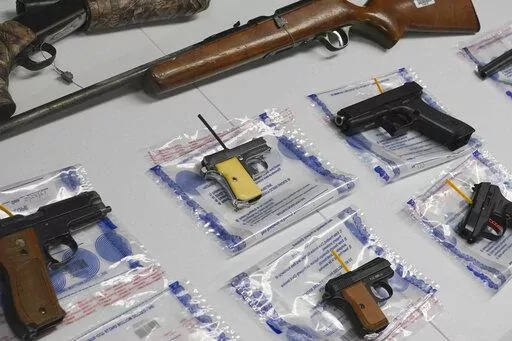 A collection of illegal guns is displayed during a gun buyback event, Saturday May 22, 2021 in the Brooklyn borough of New York. Individuals received pre-paid card payments of $25 up to $250 for firearms - with a bonus iPad for certain handguns or assault rifles, at the no-questions-asked event, co-sponsored by state and county attorney generals and the NYPD. According to a study published by JAMA Network Open on Tuesday, Nov. 29, 2022, the U.S. gun death rate in 2021 hit its highest mark in nea