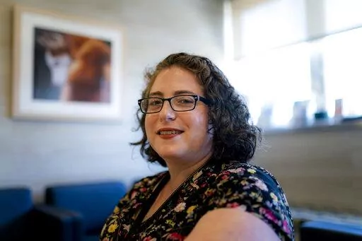 Judith Harbour, staff veterinary social worker at the Schwarzman Animal Medical Center, sits for a portrait Wednesday, June 15, 2022, in New York. The dogs get the spotlight, but the upcoming Westminster Kennel Club dog show is also illuminating a human issue: veterinarians' mental health. (AP Photo/John Minchillo)
