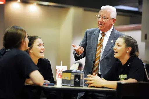 In this May 6, 2015, photo, Joe Paul, then vice president for student affairs at the University of Southern Mississippi, talks with students on campus in Hattiesburg, Miss. On Monday, Oct. 24, 2022, Paul was named president of the university.  (Eli Baylis/Hattiesburg American via AP)