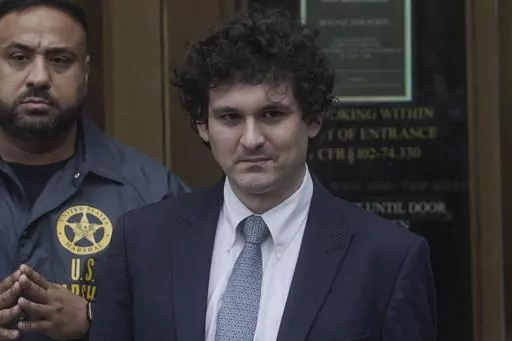 FTX founder Sam Bankman-Fried, right, leaves Manhattan federal court, Thursday June 15, 2023, in New York. Bankman-Fried's lawyers encountered a skeptical federal judge when they argued that he should toss out criminal fraud charges their client faces after the collapse of his cryptocurrency business. (AP Photo/Bebeto Matthews)