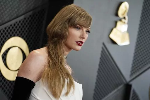 Taylor Swift arrives at the 66th annual Grammy Awards on Feb. 4, 2024, in Los Angeles. A photographer told police he was punched in the face by Taylor Swift’s father on the Sydney waterfront on Tuesday, Feb. 27, 2024, hours after the pop star’s Australian tour ended. (Photo by Jordan Strauss/Invision/AP, File)