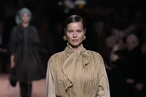 Eva Herzigova wears a creation as part of the Fendi Fall/Winter 2025-2026 Womenswear collection presented in Milan, Italy, Wednesday, Feb. 26, 2025. (AP Photo/Luca Bruno)