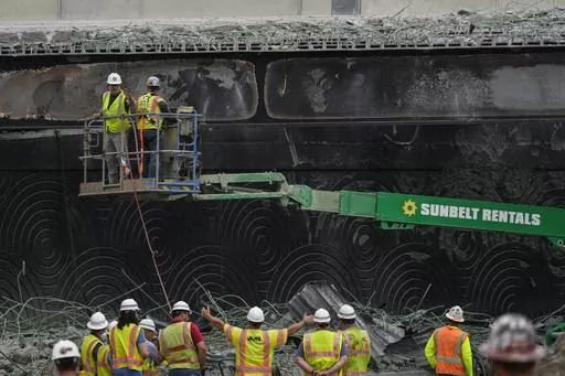 Crews continue to work the scene of a collapsed elevated section of Interstate 95, in Philadelphia, Wednesday, June 14, 2023. (AP Photo/Matt Rourke)