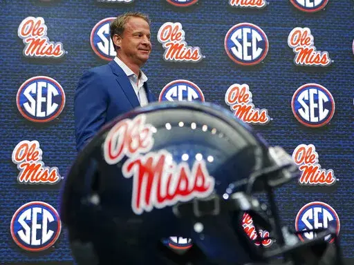 Mississippi head coach Lane Kiffin walks to the podium before speaking during NCAA college football Southeastern Conference Media Day on July 18, 2022, in Atlanta. Kiffin has picked up two dozen players from the transfer portal, including quarterback contender Jaxson Dart from USC. It was the No. 2-rated transfer class, according to 247Sports. (AP Photo/John Bazemore, File)