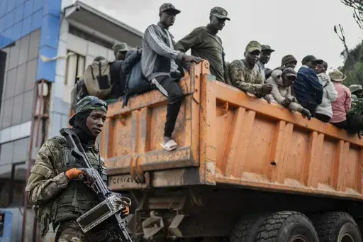 Former members of the Armed Forces of the Democratic Republic of Congo (FARDC) and police officers who allegedly surrendered to M23 rebels arrive in Goma, Congo, Sunday, Feb. 23, 2025. (AP Photo/Moses Sawasawa, file)
