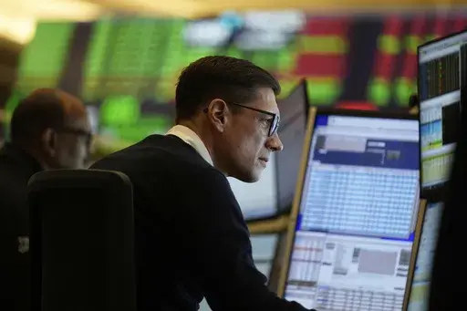 People work on the options floor at the New York Stock Exchange in New York, Wednesday, March 19, 2025. (AP Photo/Seth Wenig)
