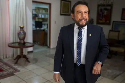 El Salvador Vice President Félix Ulloa, who is running for re-election as the running mate of President Nayib Bukele, arrives for an interview at his office in San Salvador, El Salvador, Tuesday, Jan. 30, 2024. El Salvador will hold its presidential election on Feb. 4. (AP Photo/Moises Castillo)
