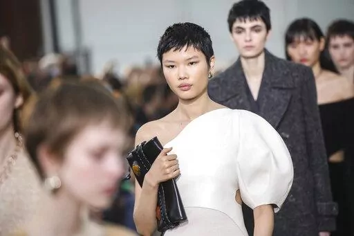 Models wear creations as part of the Chloe Ready To Wear Fall/Winter 2022-2023 fashion collection, unveiled during the Fashion Week in Paris, Thursday, March 3, 2022. (Photo by Vianney Le Caer/Invision/AP)