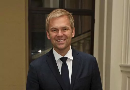 Bill Granger pose for a photo at Buckingham Palace, London, Oct. 13, 2011. Granger, the Australian chef, food writer and restaurant owner who brought Aussie-style food to international capitals from London to Seoul, has died. He was 54. Granger’s family said on social media Tuesday, Dec. 26, 2023 that the chef died in a hospital in London on Christmas Day. (Chris Radburn/PA via AP, File)