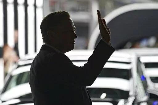 Elon Musk, Tesla CEO, attends the opening of the Tesla factory Berlin Brandenburg in Gruenheide, Germany, Tuesday, March 22, 2022.  Many people are puzzled on what a Elon Musk takeover of Twitter would mean for the company and even whether he’ll go through with the deal.  If the 50-year-old Musk’s gambit has made anything clear it’s that he thrives on contradiction.   (Patrick Pleul/Pool via AP, File)