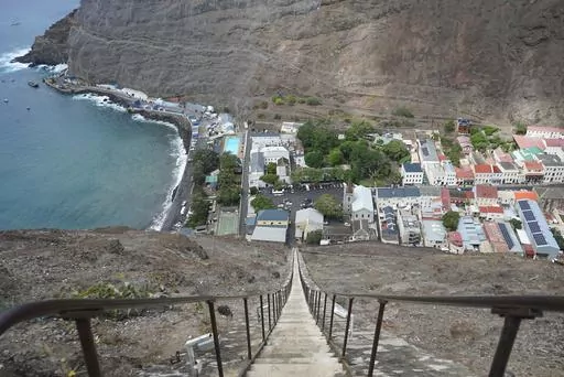 The city of Jamestown is pictured from the top of Jacob’s Ladder, a massive staircase carved into the side of a mountain on the remote island of St. Helena, Friday, Feb. 23, 2024. The 600-foot-high stairway was originally a donkey-powered cart track used to transport goods in and out of the city. (AP Photo/Nicole Evatt)