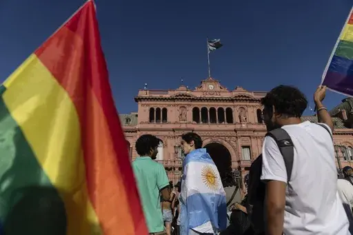 People gather in Buenos Aires, Argentina, Saturday, Feb. 1, 2025, to protest President Javier Milei’s speech at the World Economic Forum in Davos, during which he criticized “sick wokeism,” social welfare, feminism, identity politics and the fight against climate change. (AP Photo/Rodrigo Abd)