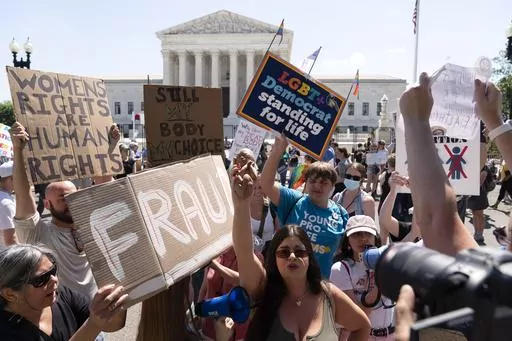 Anti-abortion demonstrators and abortion rights activists protest outside the Supreme Court in Washington, Saturday, June 25, 2022. More than a year after the Supreme Court overturned the federal right to abortion, the issue has at times dominated the discussion among the Republicans seeking their party’s 2024 presidential nomination. (AP Photo/Jose Luis Magana, File)