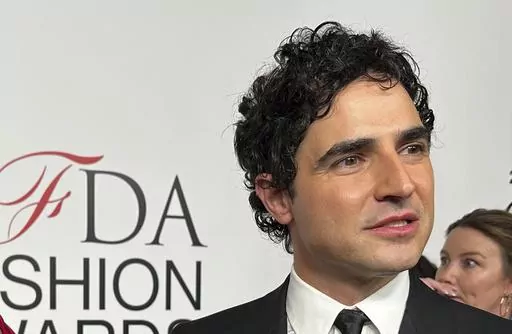 Fashion designer Zac Posen speaks with the media on the red carpet arrival at the Council of Fashion Designers of America awards, Monday, Nov. 6, 2023, in New York. In news announced Monday, Feb. 5, 2024, Gap has tapped Posen as the chain's creative director. (AP Photo/Ted Shaffrey, File)